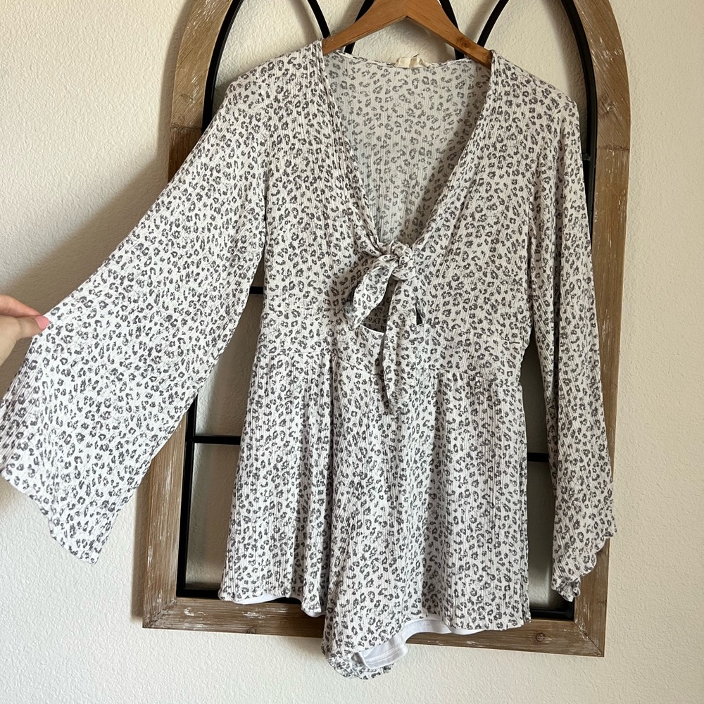 This duel layered, belle sleeved romper.